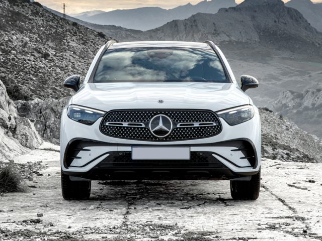 White Mercedes-Benz GLC parked in a rocky area
